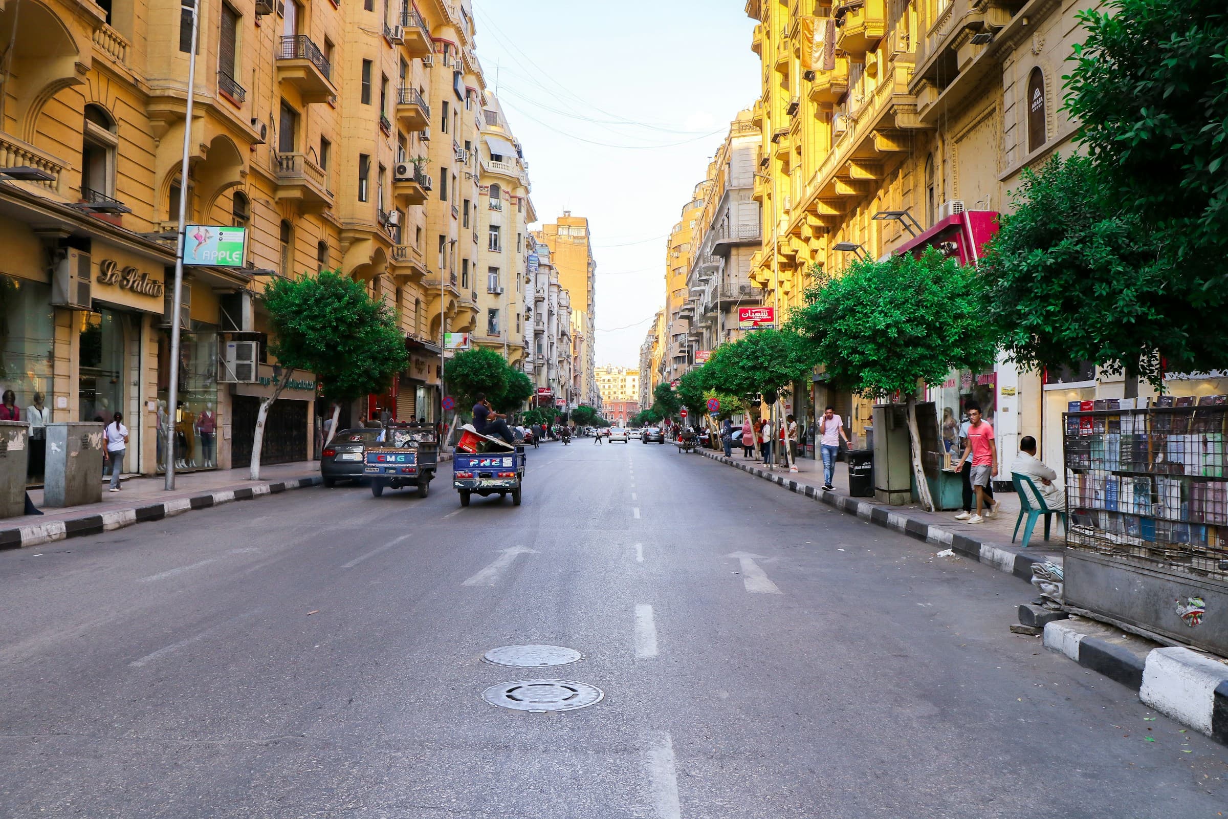 Wide ground-level shot of an Egyptian street in golden light