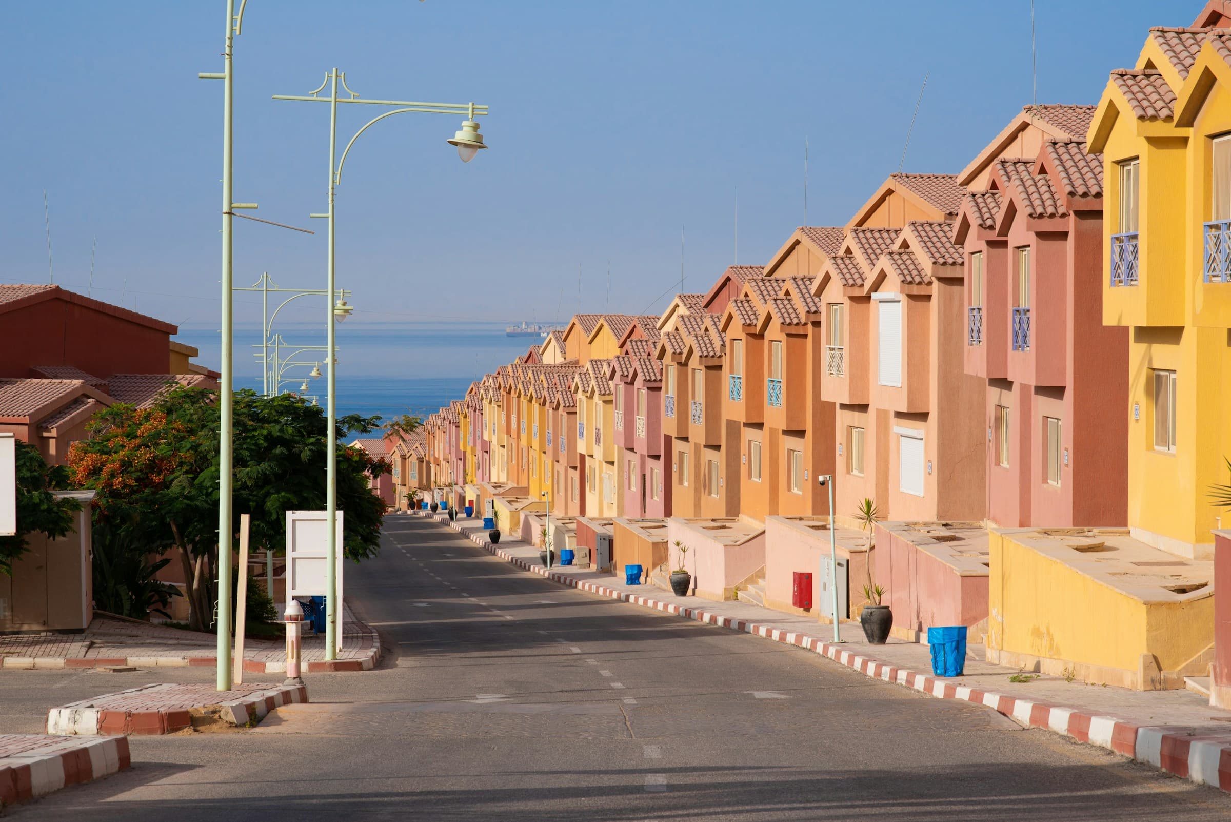 Quiet residential street with warm facades in afternoon light